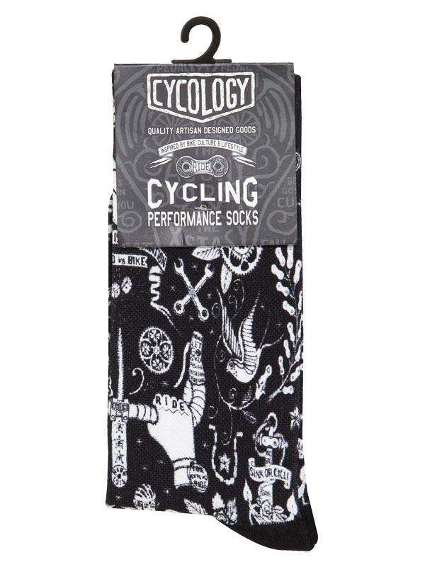 Black cycling performance socks with white tattoo-style graphics, including bikes, tools, and 'Ride' text