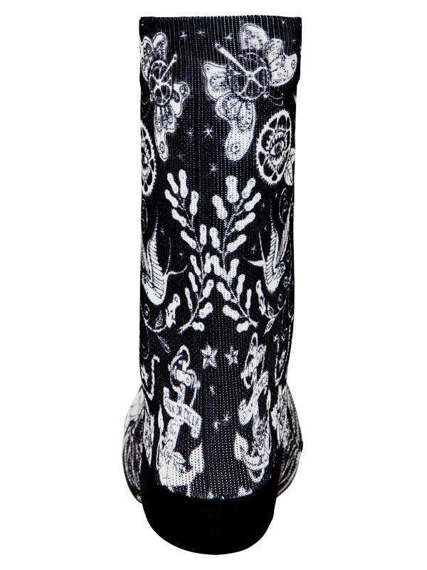 Black and white patterned cycling sock with floral and anchor designs, ideal for men's and women's bike rides.
