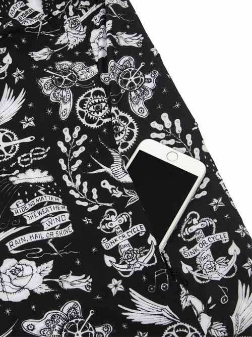 Black cycling jersey with white tattoo-style graphics, anchors, butterflies, and 'Sink or Cycle' text