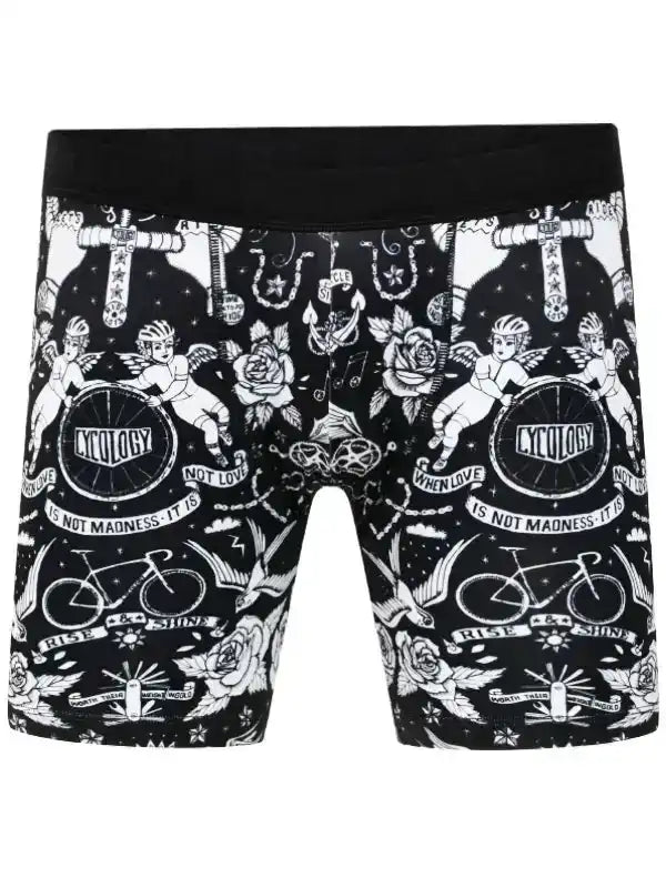 Black cycling shorts with white tattoo-style graphics, cherubs, roses, and bikes for men's or women's cycling wear