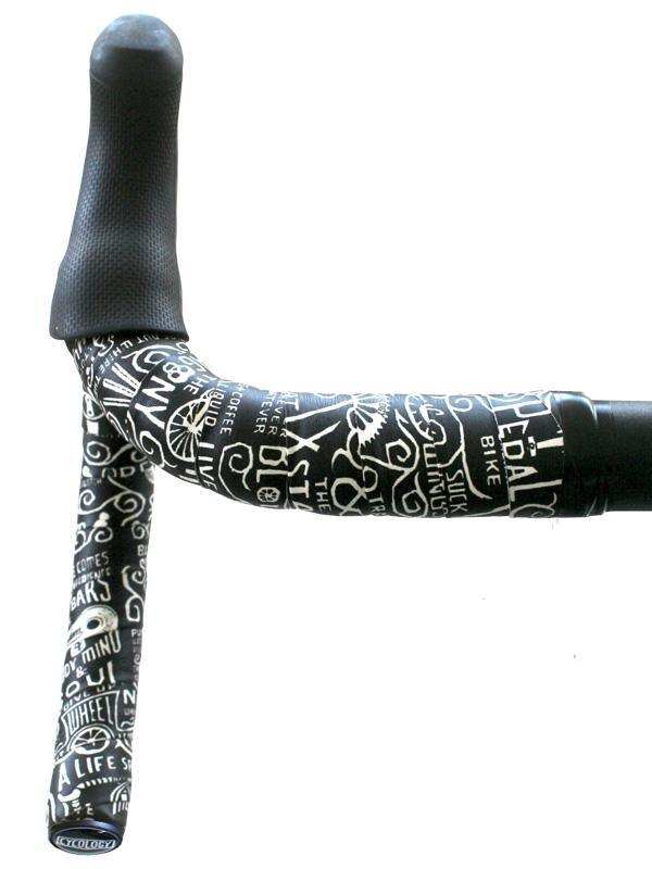 Black bike handlebar tape with white cycling-themed graphics and text, featuring ergonomic grip